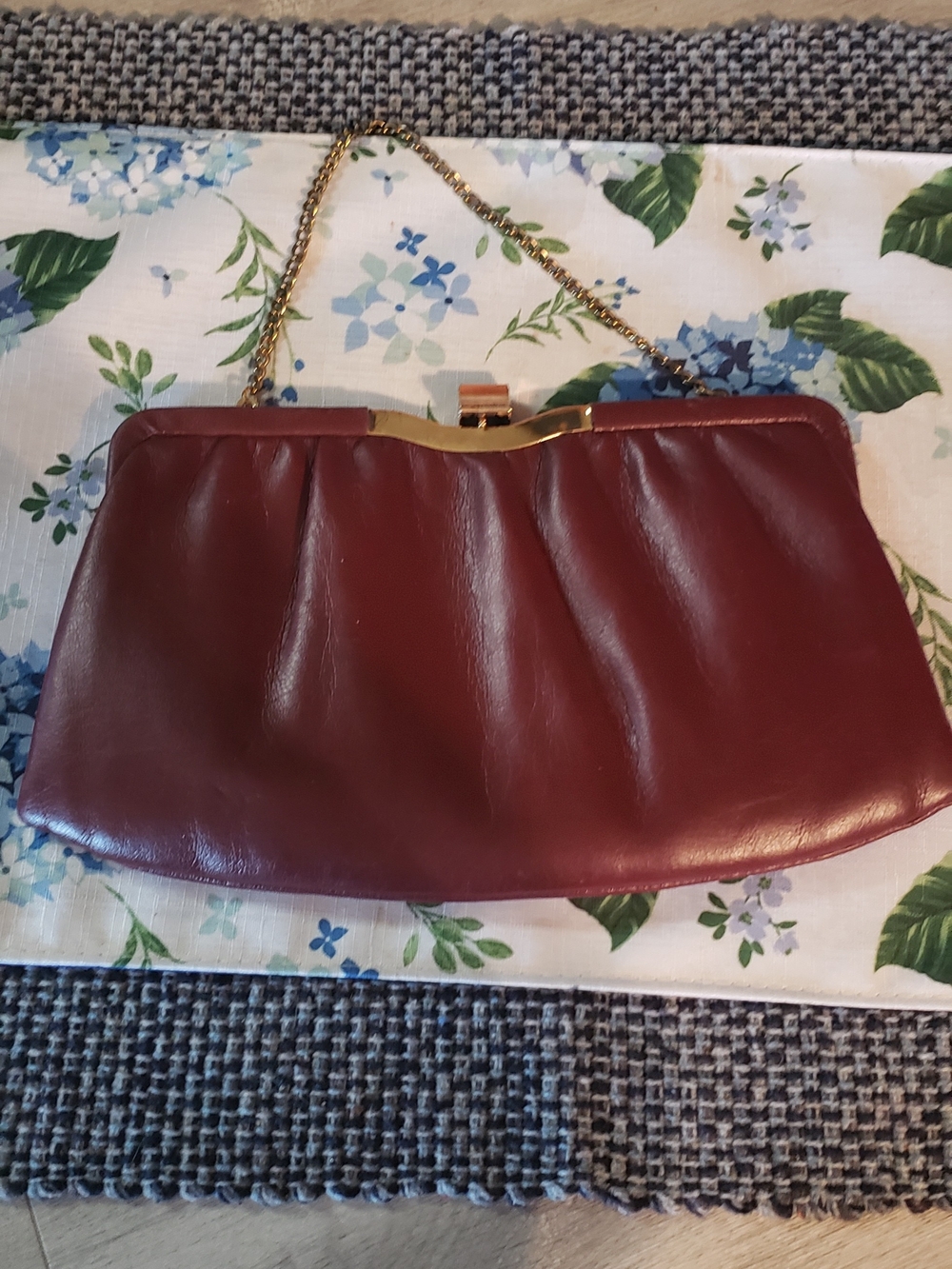 Andie Burgundy Leather Chain-Handle Clutch. Clasp And Foldable Chain.